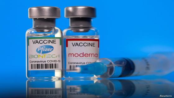 FILE PHOTO: Vials with Pfizer-BioNTech and Moderna coronavirus disease (COVID-19) vaccine labels are seen in this illustration picture taken March 19, 2021. REUTERS/Dado Ruvic/Illustration/File Photo